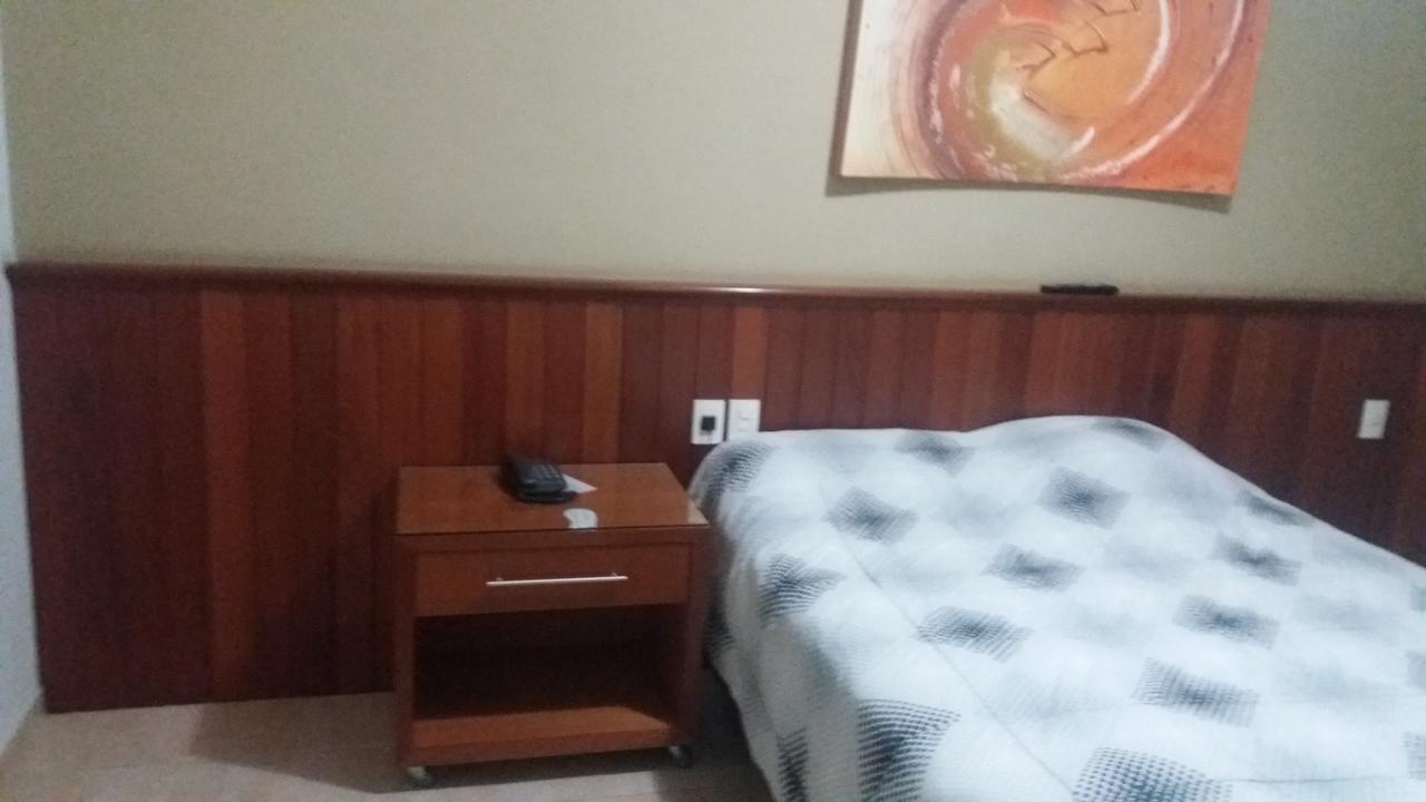 Abdon Flat Hotel Passos Esterno foto